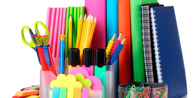 bright stationery and books isolated on white